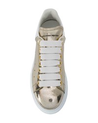Женские золотые кожаные низкие кеды от Alexander McQueen