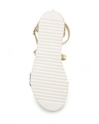 Золотые кожаные сандалии на плоской подошве от Bellamica