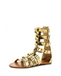 Золотые кожаные сандалии на плоской подошве от Buonarotti