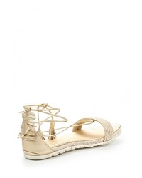 Золотые кожаные сандалии на плоской подошве от Stuart Weitzman