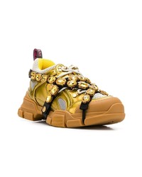 Женские золотые кроссовки от Gucci