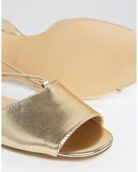 Золотые сандалии на плоской подошве от Aldo