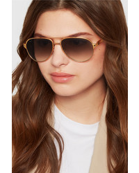 Женские золотые солнцезащитные очки от Cartier Eyewear