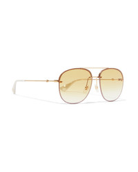 Женские золотые солнцезащитные очки от Gucci