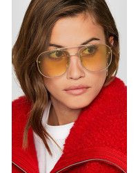 Женские золотые солнцезащитные очки от Gucci