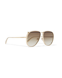 Женские золотые солнцезащитные очки от Alexander McQueen