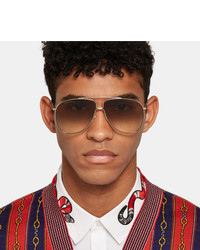 Мужские золотые солнцезащитные очки от Gucci