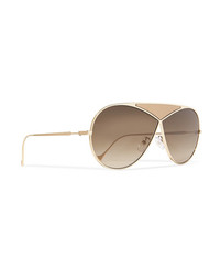 Женские золотые солнцезащитные очки от Loewe