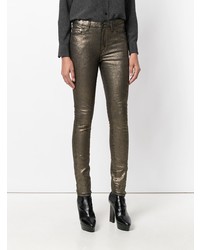 Золотые узкие брюки от Saint Laurent