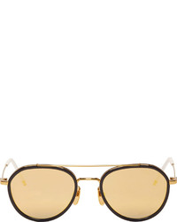 Женские коричнево-золотые солнцезащитные очки от Thom Browne