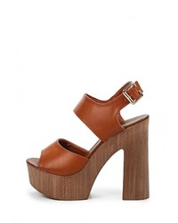 Коричневые кожаные босоножки на каблуке от Bellamica