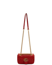 Красная кожаная стеганая сумка-саквояж от Gucci