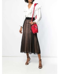 Красная кожаная сумка-мешок от Alexander McQueen