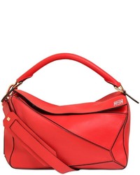 Красная кожаная сумка с геометрическим рисунком
