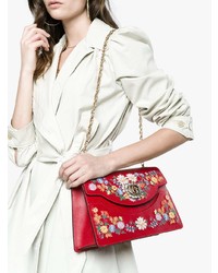 Красная кожаная сумка через плечо с цветочным принтом от Gucci