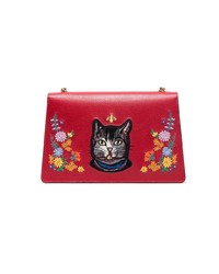 Красная кожаная сумка через плечо с цветочным принтом от Gucci