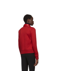 Женская красная куртка-пуховик от Moncler