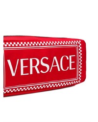 Красная поясная сумка от Versace
