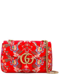Женская красная сумка с цветочным принтом от Gucci