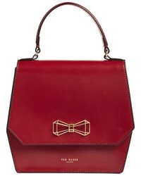 Красная сумка через плечо с геометрическим рисунком