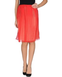Красная шелковая юбка-миди со складками