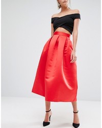 Красная юбка-миди со складками