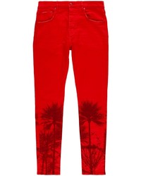 Красные зауженные джинсы с принтом