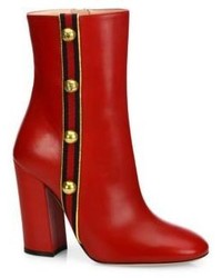Красные кожаные ботинки с шипами