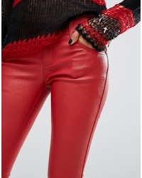 Красные кожаные узкие брюки