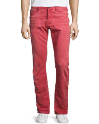 Красные рваные джинсы