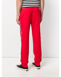 Мужские красные хлопковые брюки с принтом от Versus
