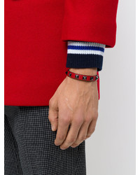 Мужской красный кожаный браслет с шипами от Valentino