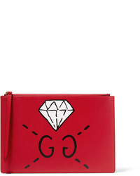 Красный кожаный клатч с принтом от Gucci