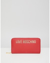 Красный кожаный клатч с принтом от Love Moschino