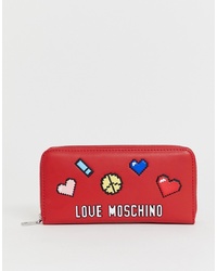 Красный кожаный клатч с принтом от Love Moschino