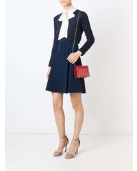 Красный кожаный клатч с шипами от Valentino