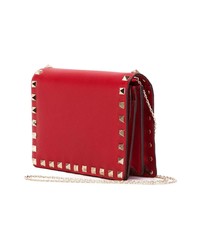 Красный кожаный клатч с шипами от Valentino