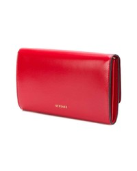 Красный кожаный клатч от Versace