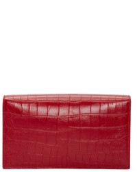 Красный кожаный клатч от Saint Laurent