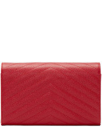 Красный кожаный стеганый клатч от Saint Laurent