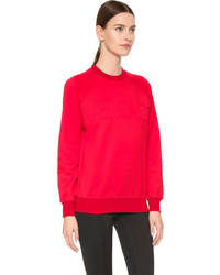 Красный свободный свитер от Versace