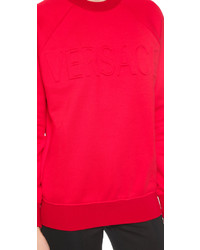 Красный свободный свитер от Versace