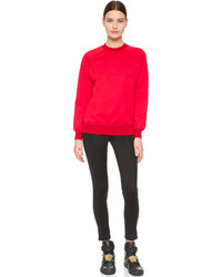 Красный свободный свитер от Versace