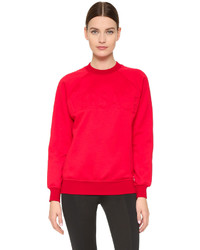 Красный свободный свитер от Versace