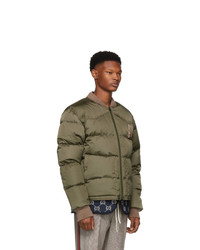Мужская оливковая куртка-пуховик с вышивкой от Gucci