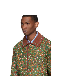Мужская оливковая куртка-пуховик с цветочным принтом от Gucci