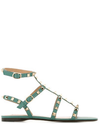 Оливковые кожаные сандалии на плоской подошве от Valentino Garavani