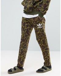 Мужские оливковые спортивные штаны с камуфляжным принтом от adidas