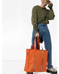 Мужская оранжевая кожаная большая сумка от Heron Preston
