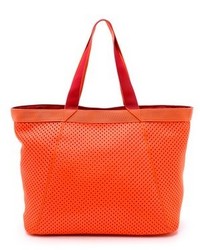 Оранжевая кожаная большая сумка от adidas by Stella McCartney